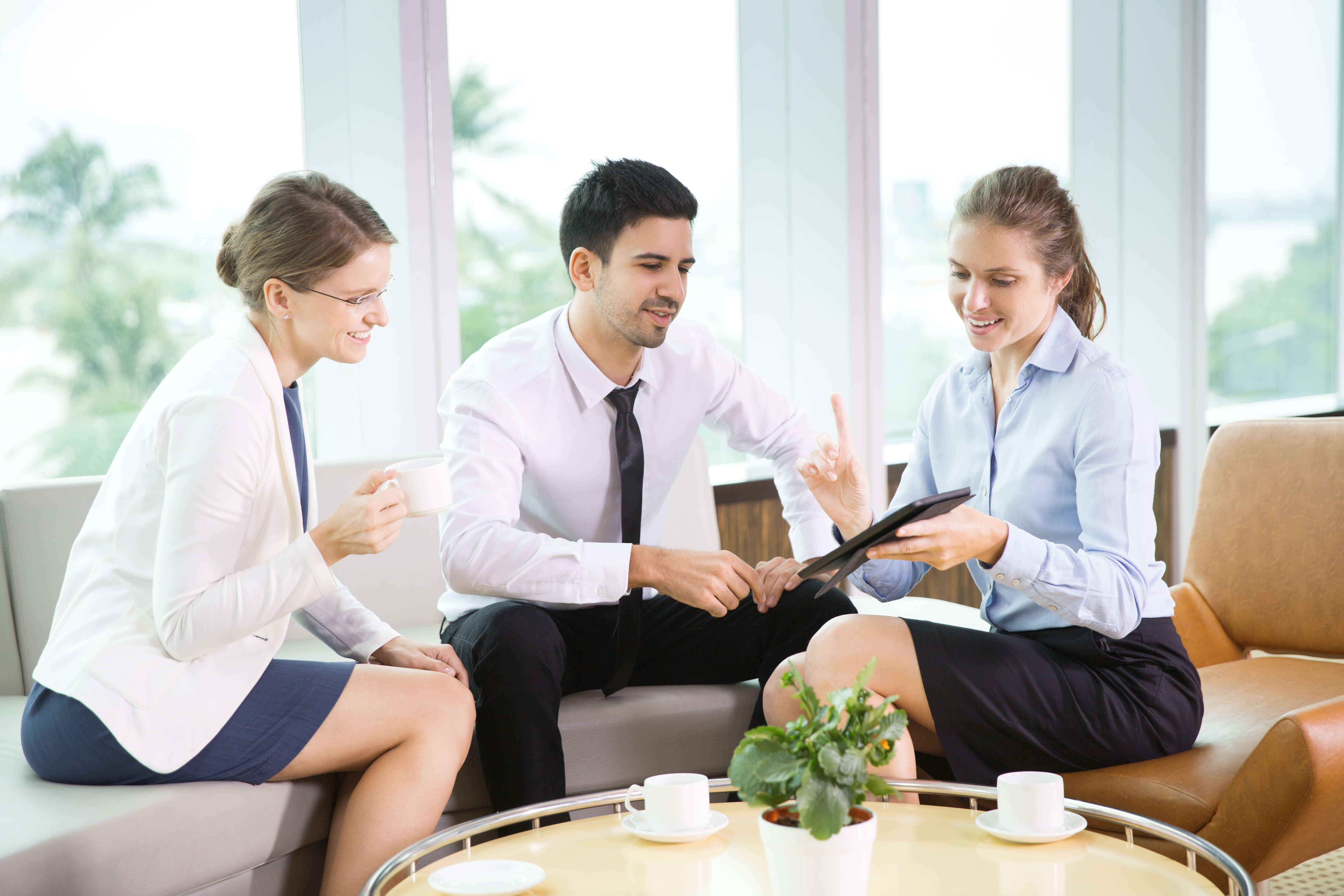 Business People Using Tablet in Cafe 1